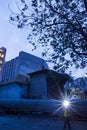 Cement plant factory manufacturing at dusk, sparks of worker with headlamp flashlight during working overtime Royalty Free Stock Photo