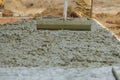 Cement pouring during sidewalk in new residential home Royalty Free Stock Photo