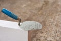 Cement powder or mortar with  trowel put on the Lightweight Concrete brick for construction work Royalty Free Stock Photo