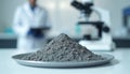 Cement powder sample analysis in lab with microscope. Gray granular concrete material on tray for science research, construction Royalty Free Stock Photo