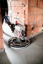 Cement smoothing trowel machinery with worker. screed, flooring smoothing at new house construction site