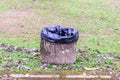 Cement trashcan with black bag at urban garden