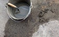 Cement trowel in bucket