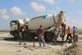 Cement truck pouring cement into a runway construction Royalty Free Stock Photo