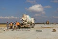 Cement truck pouring cement into a runway construction Royalty Free Stock Photo