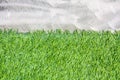 Cement wall with artificial grass background Royalty Free Stock Photo