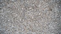 Cement wall made of small brown stones mixed together Royalty Free Stock Photo