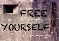 Cement wall with the word Free Yourself