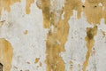 Cement yellow, embossed, rough texture with shabby white paint, plaster