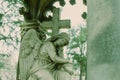 Cementery angel looking down in green tone Royalty Free Stock Photo