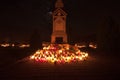 Cemetery - cross lit by candle lights Royalty Free Stock Photo