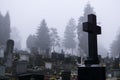Cemetery during dark misty morning or night. Royalty Free Stock Photo