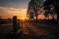 cemetery at dusk, with the sun setting over the horizon and a clear sky