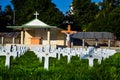 A cemetery or gravesite for the dead people to be buried. Holy graveyard of Christian people, crosses of the burial ground place Royalty Free Stock Photo