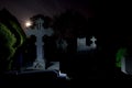 Cemetery graveyard tombstones night