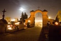 Cemetery at night. Burning candles on the graves.