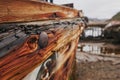 Cemetery of old ships Teriberka Murmansk Russia, wooden remains of industrial fishing boats in sea. Industrialization Royalty Free Stock Photo