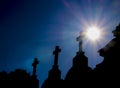 Cemetery stone cross under blue sky Royalty Free Stock Photo