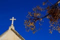 Cemetery stone cross under blue sky Royalty Free Stock Photo
