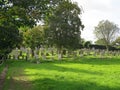 A cemetery in sunny grass