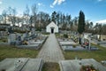 Cemetery with tombstones in the shape of a cross, angels. Many decorated graves