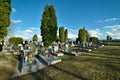 Cemetery with tombstones in the shape of a cross, angels. Many decorated graves