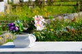 Cemetery vase arrangement with Pink and Purple flowers.