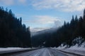 cenic asphalt road among snow-capped mountains in winter. Old Mission State Park, hwy 90, Idaho, USA, 2-8-2020 Royalty Free Stock Photo