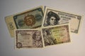 Cenital view of five and one peseta bills with white background