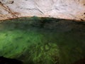 The Cenotes in Yucatan, Mexico with sedimentary rocks that infiltrate rainwater and form large caverns or water reservoirs