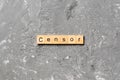 Censor word written on wood block. Censor text on cement table for your desing, concept Royalty Free Stock Photo