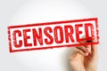 CENSORED stamp shown in bold textured print held by a hand, symbolizing restricted content and withheld material. The framed Royalty Free Stock Photo