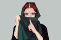 Censorship. Beauty queen beautiful woman girl oriental tikka jewelry green Muslim scarf on head looking at  camera. Isolated light Royalty Free Stock Photo