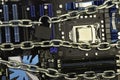 Censorship, restrictions and restrictions on a Internet. concept, motherboard in chains under lock and key Royalty Free Stock Photo
