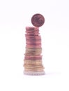 1 cent coin falling from stack of euro coins Royalty Free Stock Photo