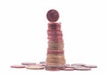 1 cent coin standing on top of stack of euro coins