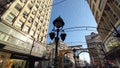 The center of the big city. Pedestrian tourist street. Top down view with wide angle. Against the background of houses and the