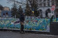 in the center of the city, people put up Ukrainian flags to honor those who died in the war