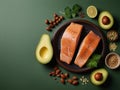 Keto diet concept - salmon, avocado, eggs, nuts and seeds, bright green background, top view