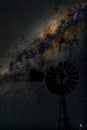 Center of Milky way galaxy with windmill in foreground