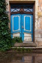 In the center of the old European city is an old wooden front door on the porch Royalty Free Stock Photo