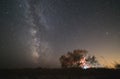 The center of our home galaxy, the Milky Way rising over the field, the night stars landscape, the tree under stars Royalty Free Stock Photo