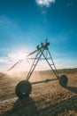 Center pivot irrigation system with drop sprinklers in field Royalty Free Stock Photo