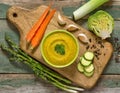 Vegetable puree in a wooden bowl on a wooden background. AI-generated image