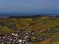 Center of small village Durbach, Baden-Wuerttemberg, Germany in fall with colorful vineyard hills in the surroundings. Royalty Free Stock Photo