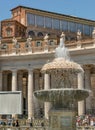 Center of St. Peter's square with Bernini's Fountain located dir