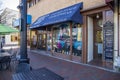 Center Stage Dancewear with clothing and apparel in the storefront window and a blue awning in the window in the Marietta Square