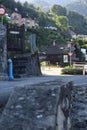 Center view on a building employee that clean the road in the golden light