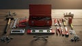 Centered is an open red metal toolbox containing various tools Royalty Free Stock Photo