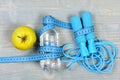 Centimeter tied around sports equipment in cyan blue